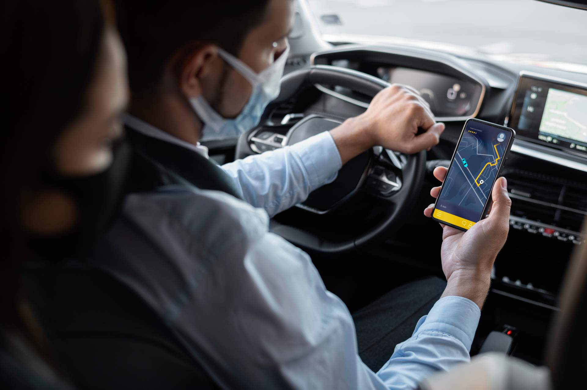 young-male-being-uber-driver-female-client (1)